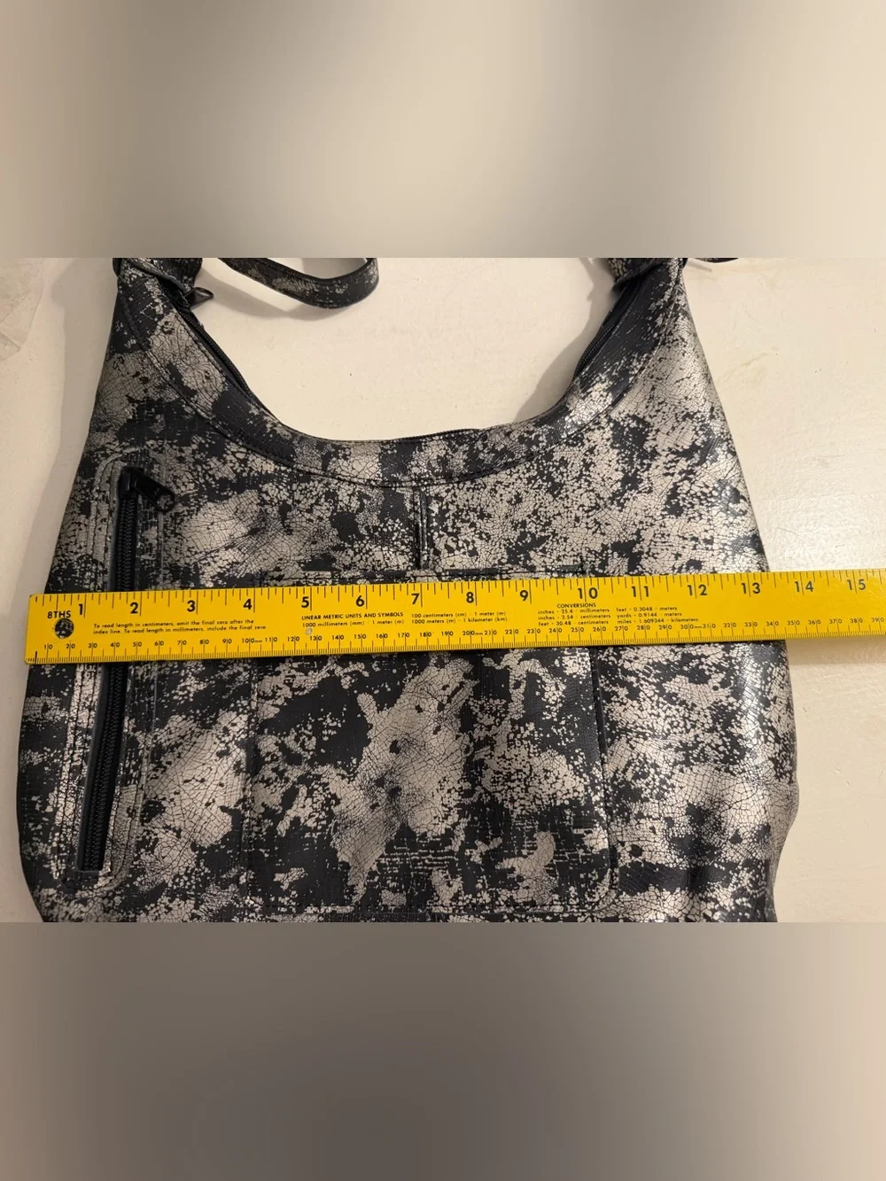 Elie metallic silver/black leather hobo bag.(Made in USA)